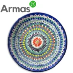 Uzbek ceramic plate with colorful geometric mandala and red flower in the center